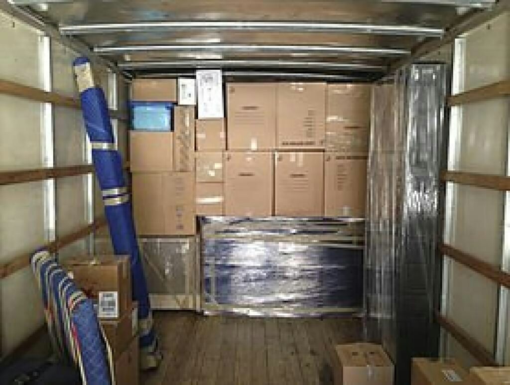 Moving truck loaded with cardboard boxes, ready for a removalist job